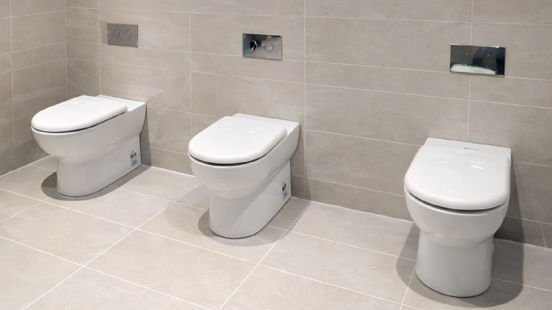 commercial toilet installation with modern fixtures